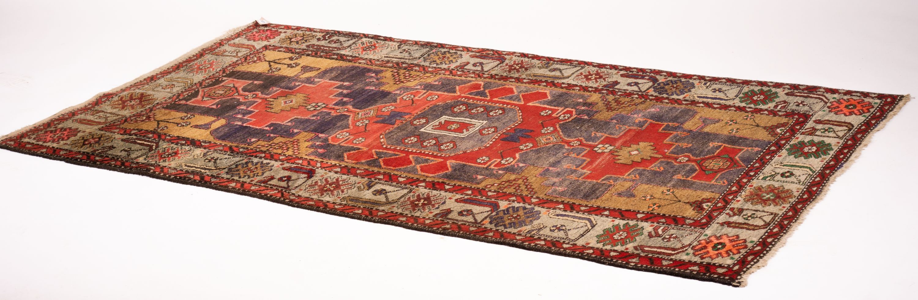 A Caucasian Kazak blue ground rug, 206 x 128cm